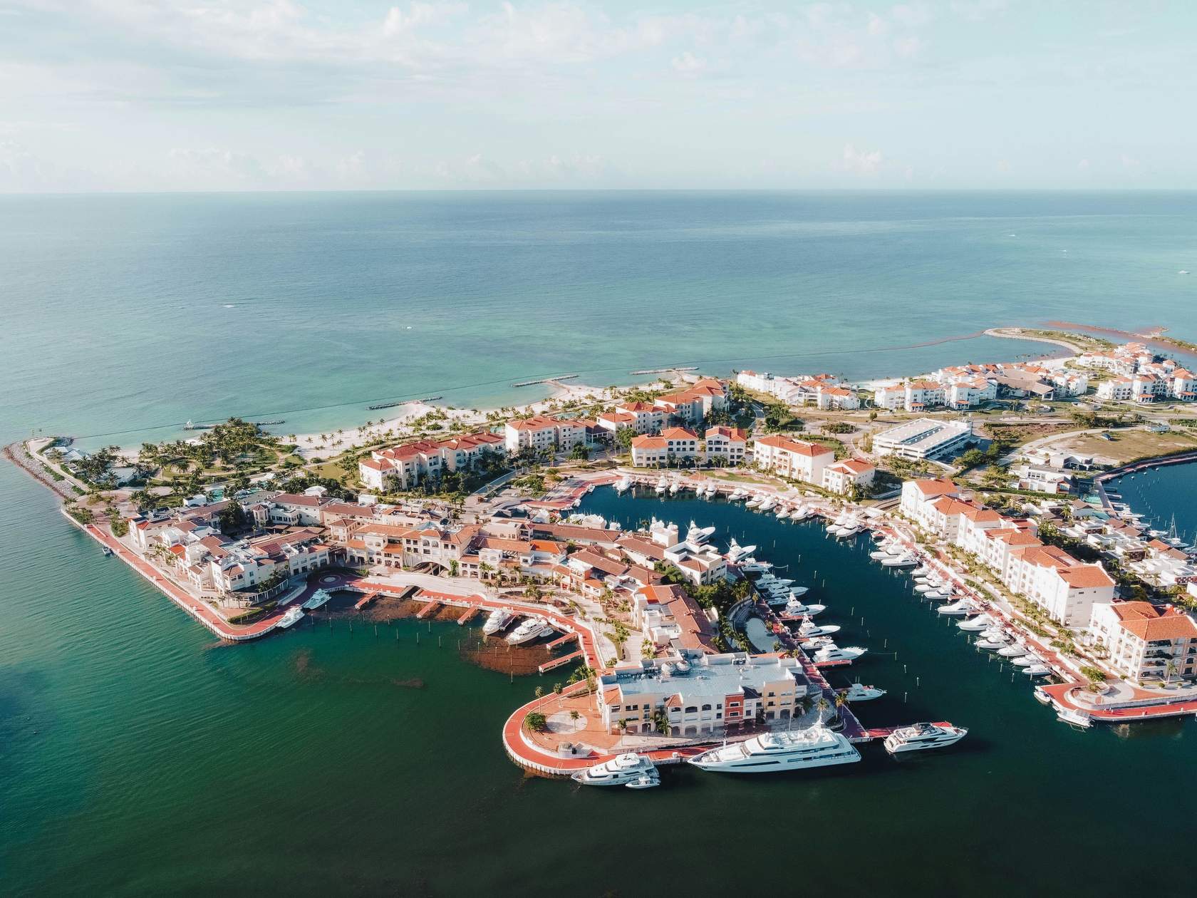 Aerial view of a Caribbean marina resort at golden hour